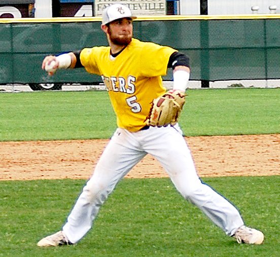 BEN MADRID ENTERPRISE-LEADER Prairie Grove senior J.D. Speed tries to prevent a run and throw out a baserunner at home plate.