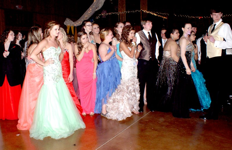 In tuxes and formals, students attending the Gravette High School prom are ready for the music to start.