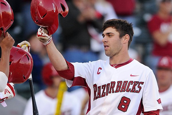 Arkansas' Tyler Spoon rounds the bases after hitting a home run during the game against UNLV in Baum Stadium in Fayetteville on Wednesday April 9, 2014. Arkansas won 9-2.