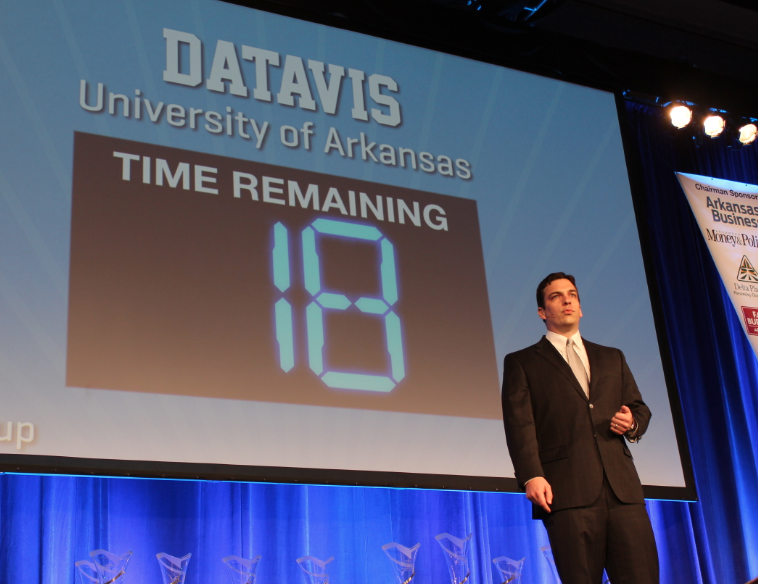 University of Arkansas graduate student Mike Finan presents for the DataVis team Wednesday at the Donald W. Reynolds Governor's Cup in Little Rock.