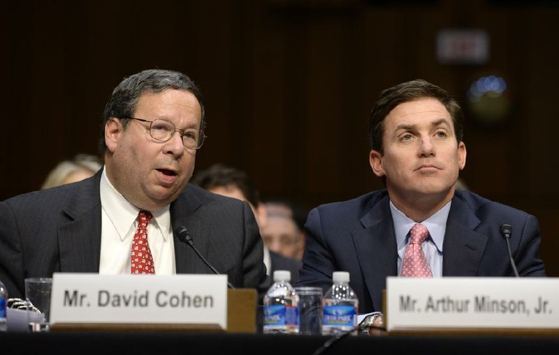 Comcast Corp. Executive Vice President David Cohen (left) testifies Wednesday before the Senate Judiciary Committee with Arthur Minson Jr., Time Warner Cable Inc.’s executive vice president and chief financial officer.