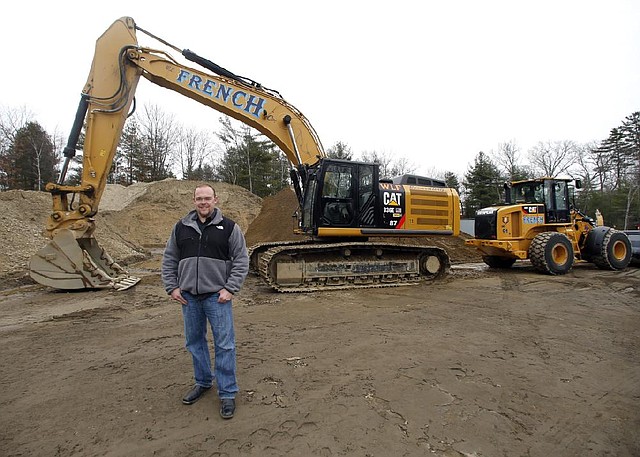 Bill French Jr., owner of W.L. French Excavating Corp., stands on his company property Monday in North Billerica, Mass. Behind him is equipment he bought with small-business tax breaks before they expired at the end of 2013. 