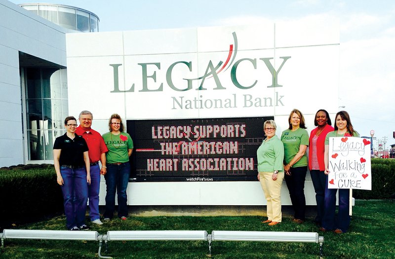 COURTESY PHOTO 
Employees from Legacy National Bank on U.S. 412 in Springdale recently participated in National Walking Day by walking 15 minutes in shifts. Bank employees who participated in the event include Kellie Holmes (from left), Glen Plumlee, Connie Griepenstroh, Betty Phillips, Mary Alice Granata, Jessica Johnson and Jamie Newberry. The group will also participate in the American Heart Association’s Heart Walk.