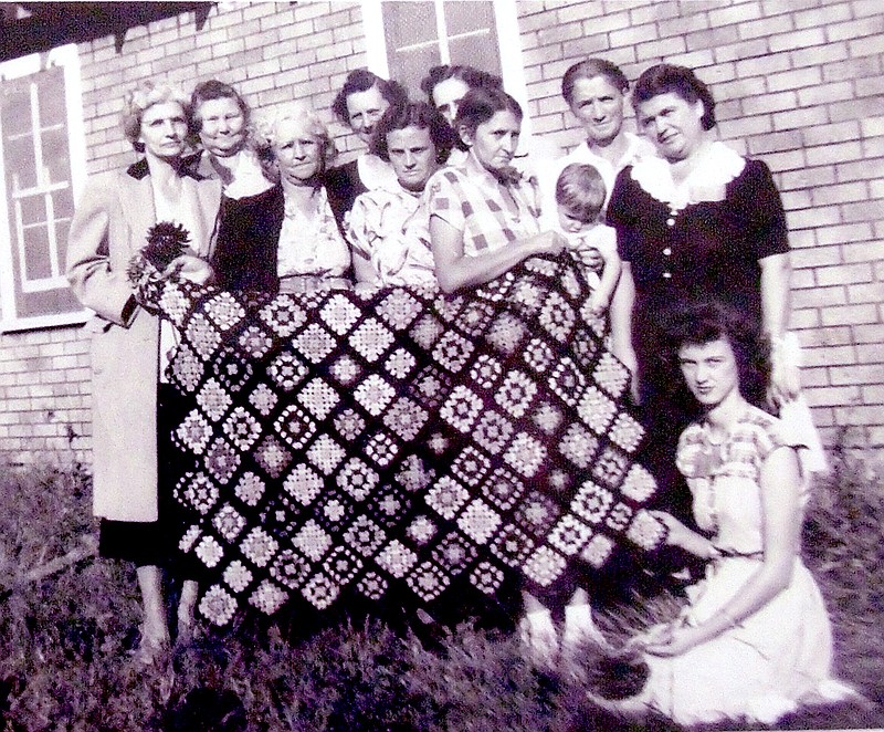 COURTESY PHOTO An undated photo from the 1940s shows Bunker Hill Club members holding one of their projects. The names are listed in unknown order: Mrs. Jackson, Leta Templeton, Lou Teague, Stella Bethel, Francis Lauderdale, Founty Abercrombie, Viola Schlessman, Murel Russell, and sitting on the ground, Doris Jean Russell Sellers.