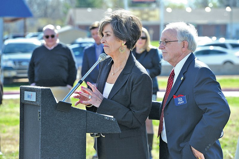 STAFF PHOTO ANTHONY REYES Nancy Trammel and husband Dick Trammel speak Wednesday at the ground breaking ceremony in Rogers.