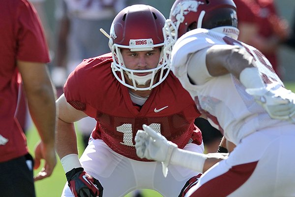 Arkansas tight end A.J. Derby picks up a block as the hogs run drills during the Razorbacks practice Thursday afternoon in Fayetteville.