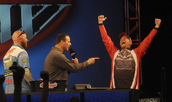 FILE PHOTO FLIP PUTTHOFF 
Steven Meador of Bella Vista, right, celebrates his FLW co-angler championship in last year's Walmart FLW bass tournament at Beaver Lake. At left is second-place co-angler David Lauer of Florida. Chris Jones, emcee, is at center.