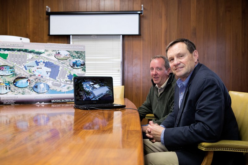 Parks and Recreation Director Jeff Owens, left, and Batesville Mayor Rick Elumbaugh are seen with artist‘s renderings of the new Batesville community center.