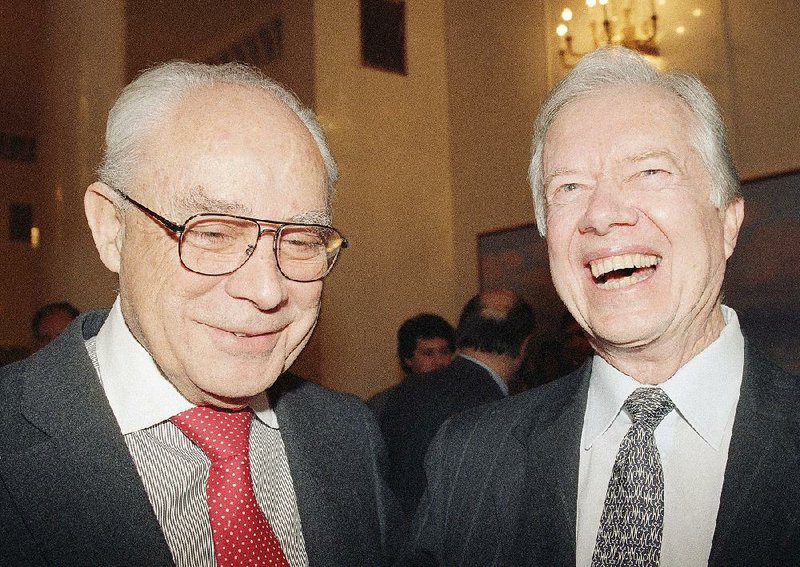 Robert Strauss and friend share a laugh in 1992. 