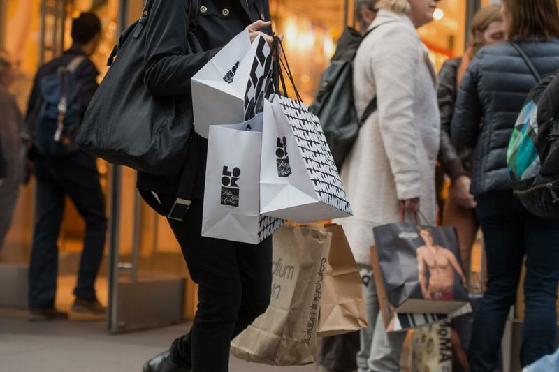 Shoppers crowd Fifth Avenue in New York earlier this week. A report released Friday said consumer confidence jumped in April as shoppers started to shrug off the effects of a harsh winter. 