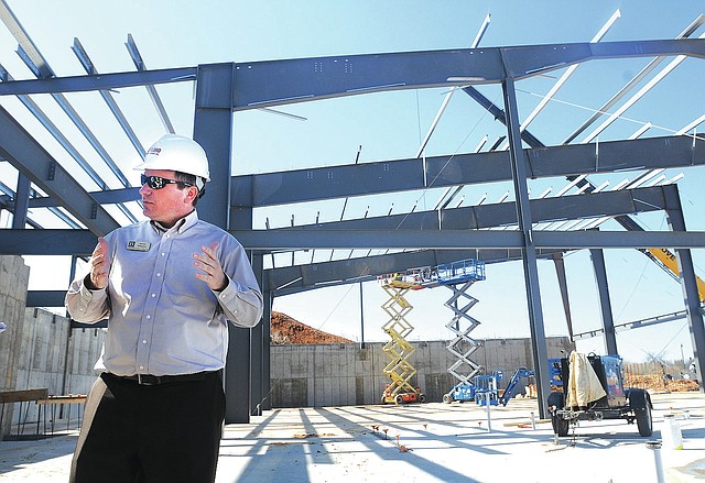 STAFF PHOTO SAMANTHA BAKER &#8226; @NWASAMANTHA David Wright, director of parks and recreation, talks Wednesday about the layout of the Bentonville Community Recreation Center at 1101 S.W. Citizens Circle. The 82,000 square-foot facility is to open in the first half of 2015.