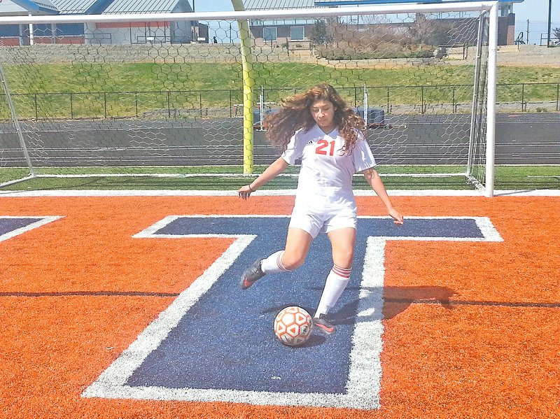 STAFF PHOTO PAUL BOYD Erika Reyes, Rogers Heritage junior, has used her phyiscal and emotional toughness to elevate from junior varsity to a starting spot on the Lady War Eagles varsity soccer team this season.
