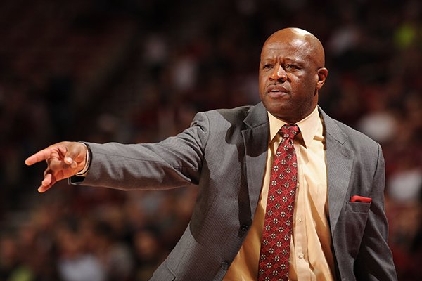 Arkansas coach Mike Anderson directs his players from the bench during the second half of play against Southern Methodist Monday, Nov. 18, 2013, in Bud Walton Arena in Fayetteville.