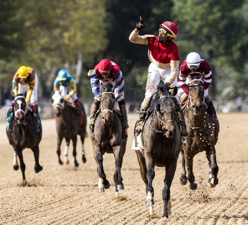 Arkansas Democrat-Gazette/MELISSA SUE GERRITS - 04/12/2014 -  Ramon Vazquez celebrates his win in the stakes race at Oaklawn Park April 12, 2014. 