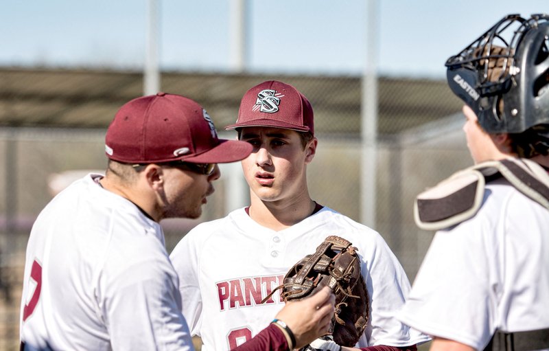 Bud Sullins/Special to Siloam Sunday Siloam Springs baseball coach Jacob Gill gives instructions during a meeting on the mound as first baseman John Austin Earles, center, and catcher Matthew McSpadden look on during Game 1 of Wednesday&#8217;s 7A/6A-West Conference doubleheader against Springdale Har-Ber.