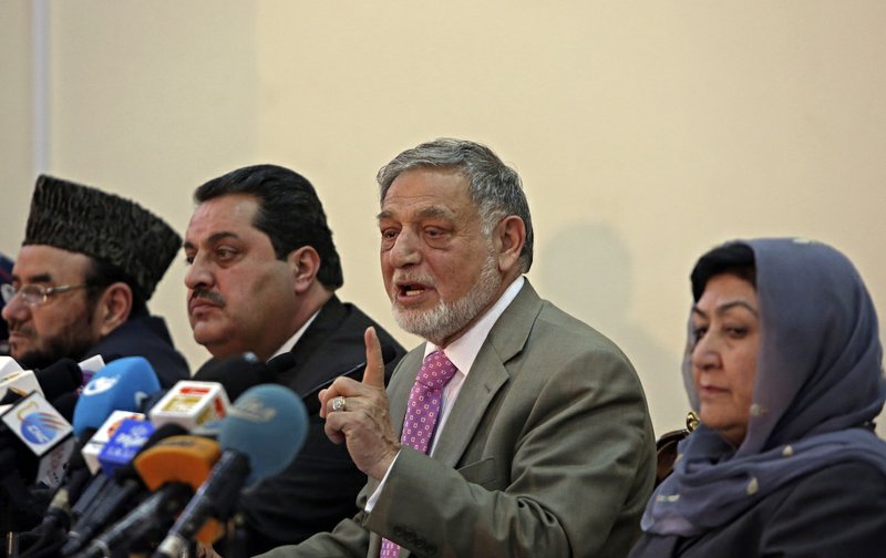 Ahmad Yousuf Nouristani, chairman of the Independent Election Commission, from right second, speaks during a press conference in Kabul, Afghanistan, Sunday, April 13, 2014. Partial results released Sunday in Afghanistan’s crucial presidential election show a tight race between ex-foreign minister Abdullah Abdullah, with 41.9 percent of the vote, and former finance minister Ashraf Ghani, with 37.6 percent.