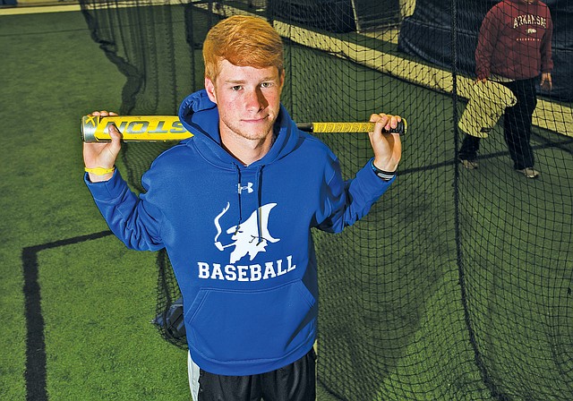 STAFF PHOTO ANTHONY REYES Carter Forbis, Rogers High senior outfielder, stands Monday in the school&#8217;s indoor pavilion.