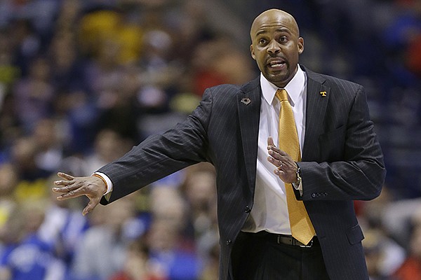 In this March 28, 2014, file photo, Tennessee head coach Cuonzo Martin directs his team during the second half of an NCAA Midwest Regional semifinal college basketball tournament game against Michigan in Indianapolis. Cal announced the hiring of Tennessee's Martin Tuesday, April 15, 2014. He replaces Mike Montgomery, who retired last month after six seasons in Berkeley. (AP Photo/Michael Conroy, File)