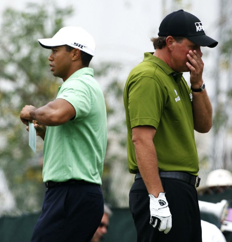 Tiger Woods (left) and Phil Mickelson were not playing on Sunday at Augusta National for the first time in 20 years. Woods missed the tournament after back surgery and Mickelson missed the cut. It could signal the end of a golfing rivalry from which fans expected to see years of thrilling matches. 