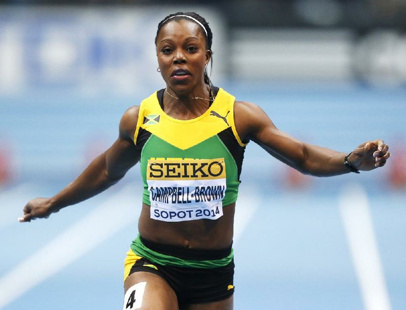 FILE- In this file photo dated Saturday, March 8, 2014, Jamaica's Veronica Campbell-Brown runs in the 60m heats during the Athletics World Indoor Championships in Sopot, Poland. Sport’s highest appeals body, The Court of Arbitration for Sport released its full report Tuesday April 15, 2014, saying Jamaican Olympic sprinter Veronica Campbell-Brown was cleared of doping because of blatant flaws in the test collection procedures and possible ``environmental contamination’’ of her urine sample. (AP Photo/Petr David Josek, FILE)