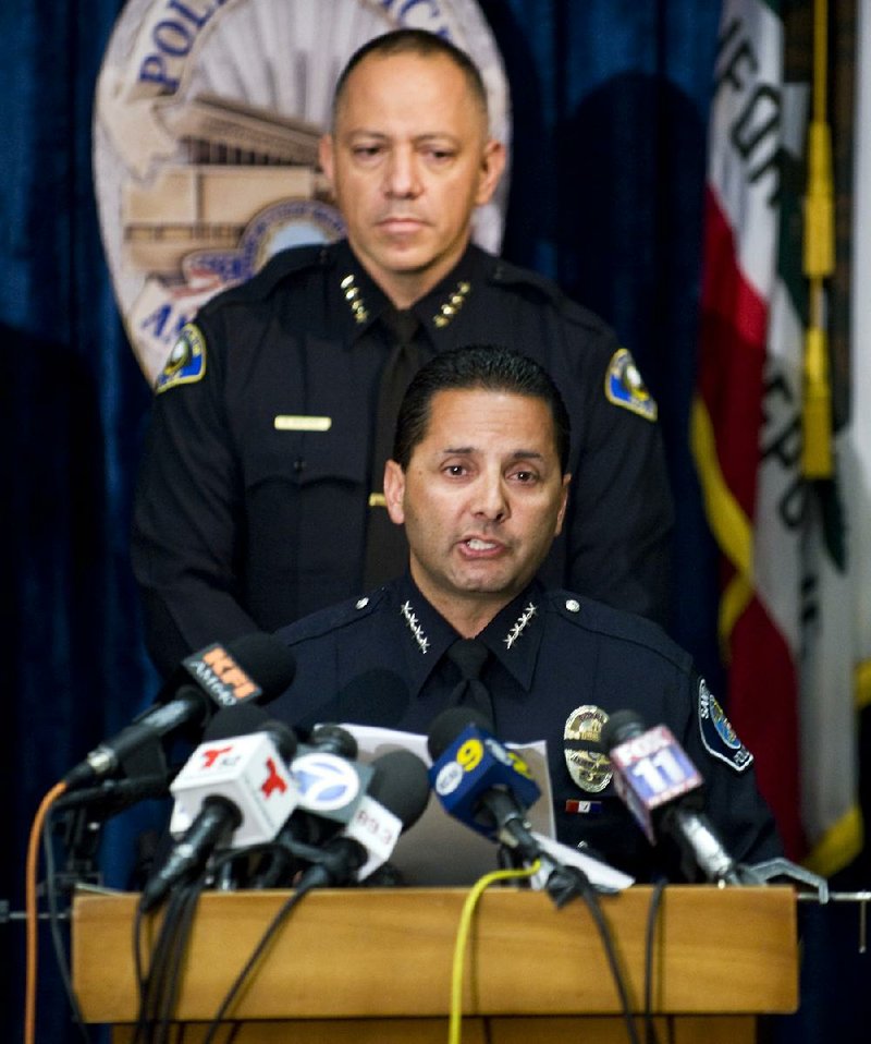 Santa Ana, Calif., Police Chief Carlos Rojas (front), with Anaheim Chief Raul Quezada, said Tuesday in Anaheim that investigators didn’t realize at first the the missing people were murder victims. 