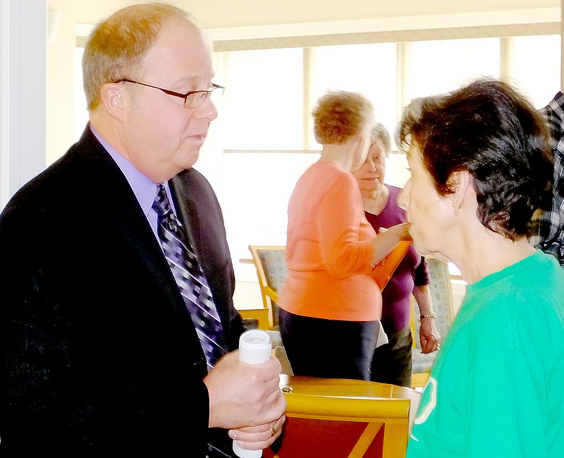 Lynn Atkins/The Weekly Vista Steve Jaberg, CEO of Cedar Communities, spoke at the Plaza on the changing face of health care. One of the questions he answered was posed by Ginger Hamilton who stopped to talk after the presentation.