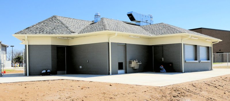 Photo by Randy Moll The new concession stand at Pioneer Stadium was nearing completion on April 9, with workers caulking around the building.