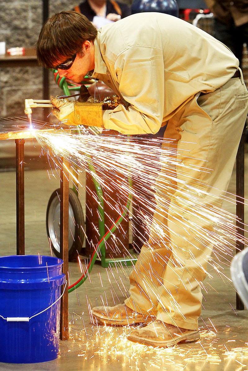 The Sentinel-Record/Richard Rasmussen Cory Carr, a student at West Side High School in Greers Ferry, competes in the welding competition during the Arkansas SkillsUSA State Championships at the Hot Springs Convention Center Tuesday. More than 1,600 high school and college students from across the state competed in dozens of career areas.