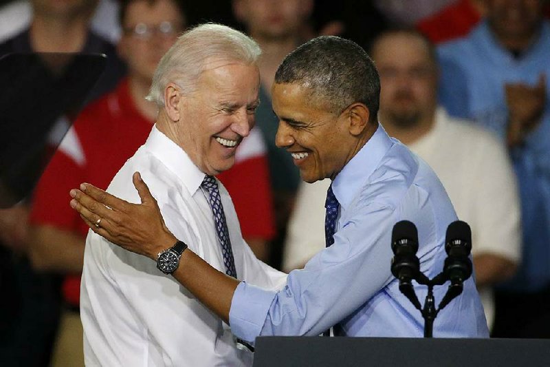 President Barack Obama is introduced by Vice President Joe Biden on Wednesday as he arrives at the Community College of Allegheny County West Hill Center in Oakdale, Pa. The visit was to promote the administration’s Opportunity for All program to train the workforce for careers in fi elds with a growing demand. 