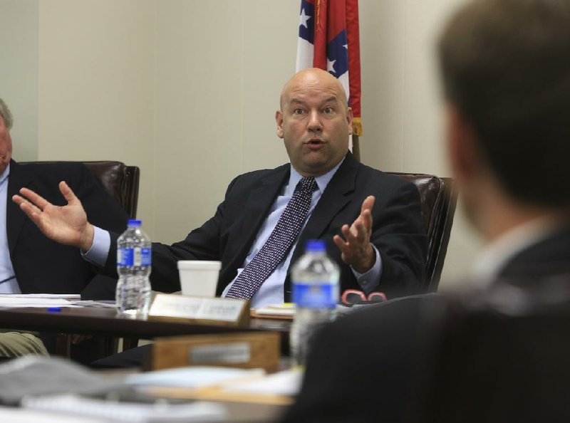 Lottery Director Bishop Woosley takes a question about the possibility of adding “keno” style games during a Arkansas Lottery Commission meeting on April 16, 2014. 