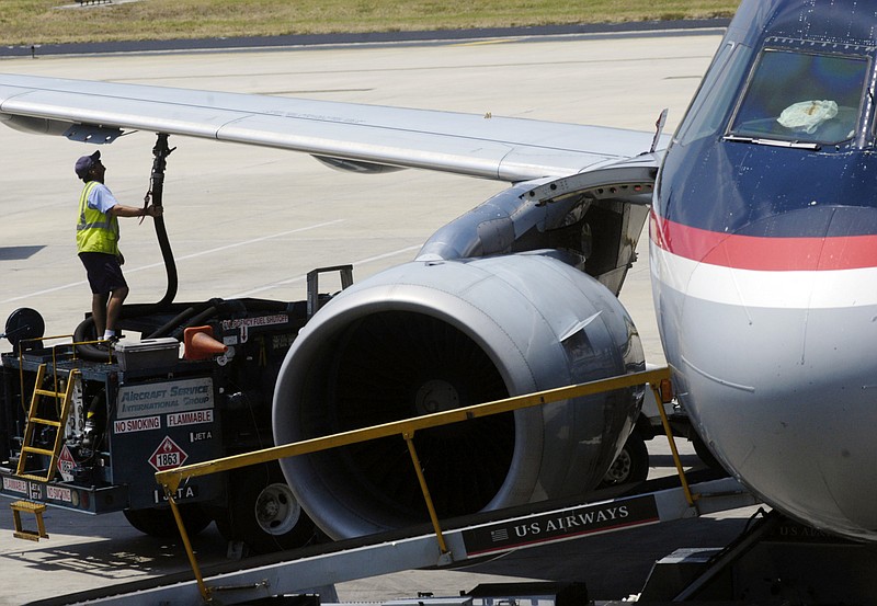 The Associated Press HIGH FLYING: In this June 12, 2008 photo, a worker hooks up a fuel hose to an airplane at Tampa International Airport in Tampa, Fla. Airline executives frequently complain about fuel costs. But the truth is higher prices actually have been good for business.