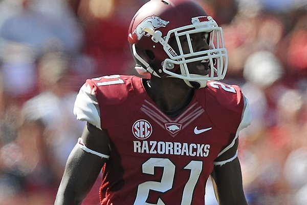 Arkansas' Carroll Washington celebrates breaking up a pass Oct. 12, 2013, during the first quarter of the game against South Carolina at Donald W. Reynolds Razorback Stadium in Fayetteville.