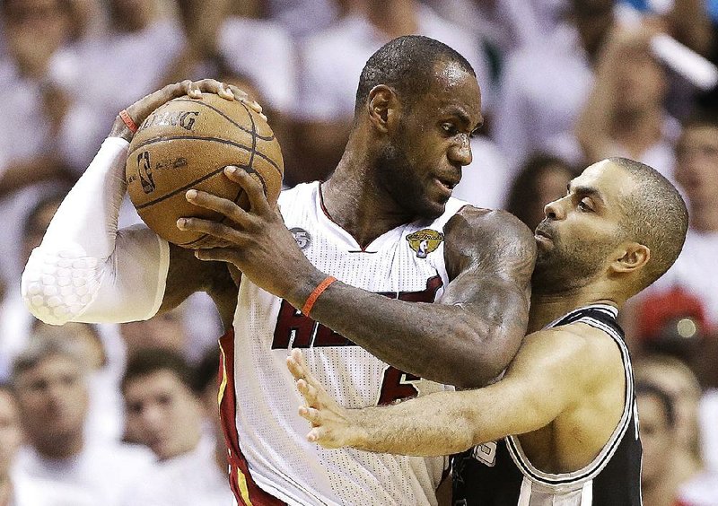 Tony Parker (right) and the San Antonio Spurs could face the Miami Heat and LeBron James in the NBA Finals again this year, but both teams have to survive tough tests to get there. 