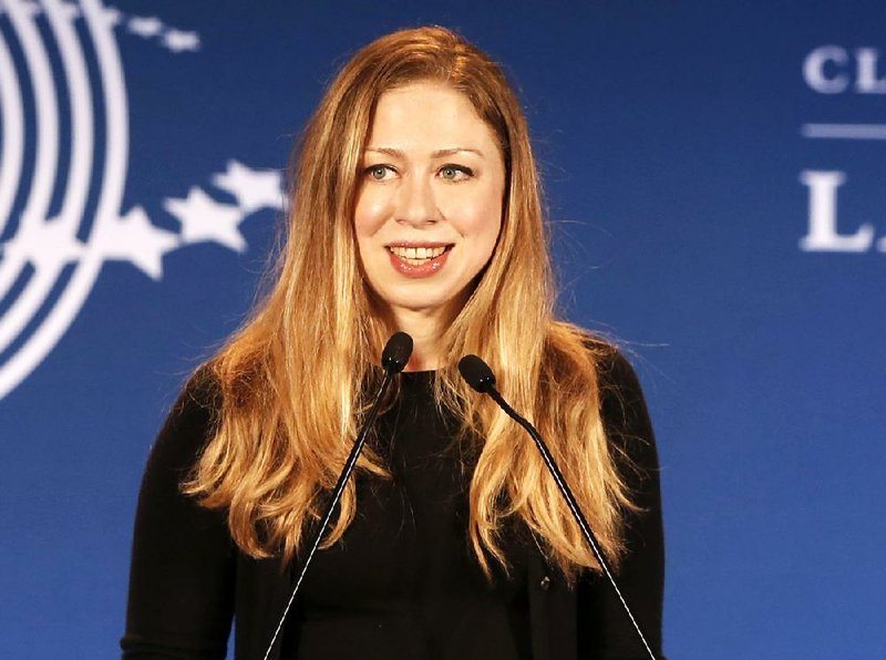 FILE - In a Dec. 9, 2013, file photo Chelsea Clinton speaks in Rio de Janeiro, Brazil. Chelsea Clinton says she and her husband are expecting their first child later this year. The daughter of former President Bill Clinton and former Secretary of State Hillary Rodham Clinton announced at a Clinton Foundation event in New York that she and her husband, Marc Mezvinsky, are "very excited" to be having their first child later this year.  (AP Photo/Silvia Izquierdo, file)