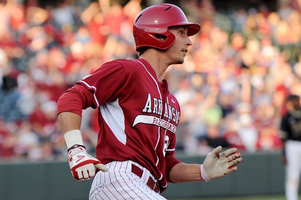 Arkansas first baseman Eric Fisher rounds the bases after hitting a home run during the game against Vanderbilt on Friday April 18, 2014, at Baum Stadium.