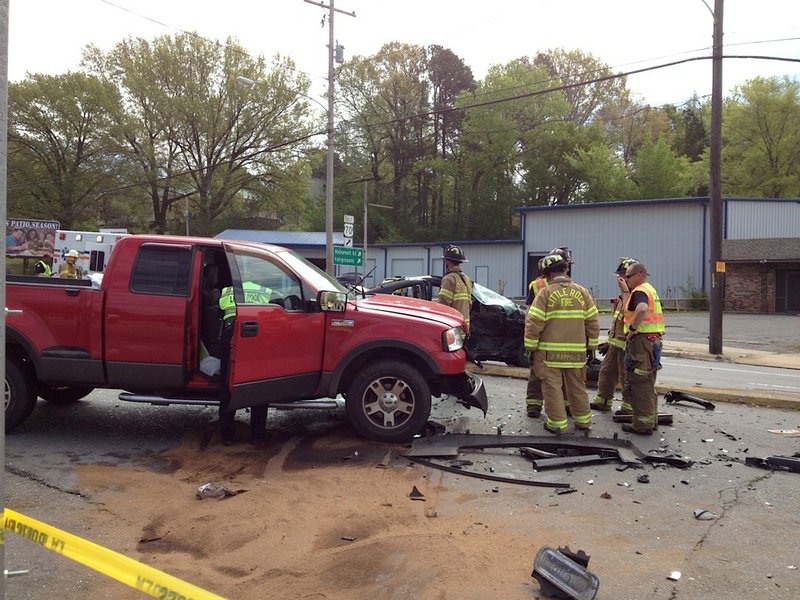 Emergency officials respond Friday morning to an accident near Asher Avenue and Roosevelt Road in Little Rock.