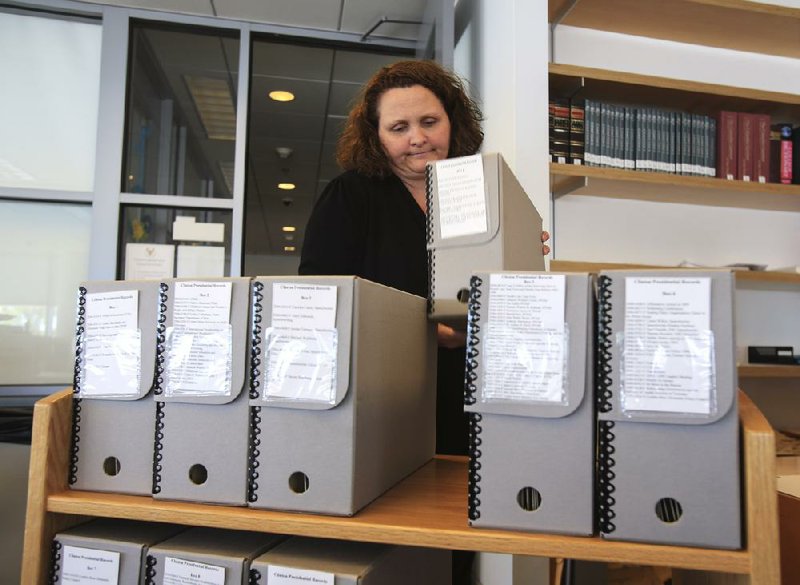 Archivist Dana Simmons prepares documents for release Friday at the Clinton Presidential Center in Little Rock. 