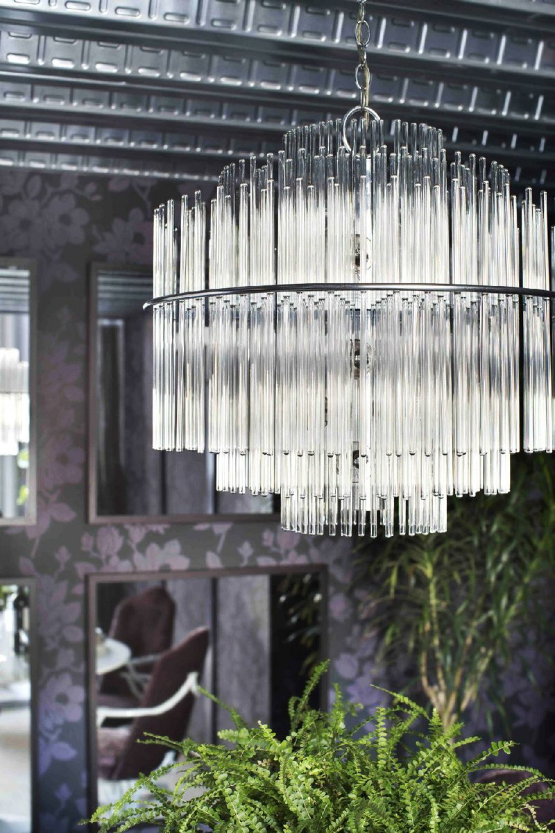 To ensure safety, designer Brian Patrick Flynn had this 1960s-era glass and chrome chandelier — found for $150 at a flea market — rewired before installing it in a dining room.
