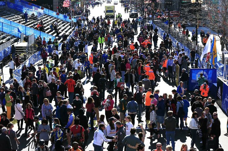 People gather at the finish line ahead of Monday’s 118th Boston Marathon, along Boylston Street on Saturday in Boston. This year’s race is expected to feature one of the best American fields in a long time. 