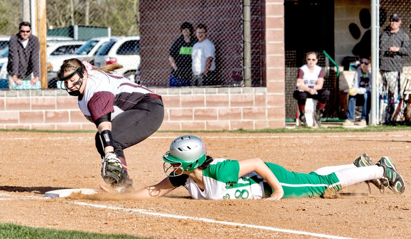 Bud Sullins/Special to Siloam Sunday Siloam Springs first baseman Shayla Simmons attempts a tag on a Van Buren base runner during Tuesday&#8217;s game at La-Z-Boy Park.