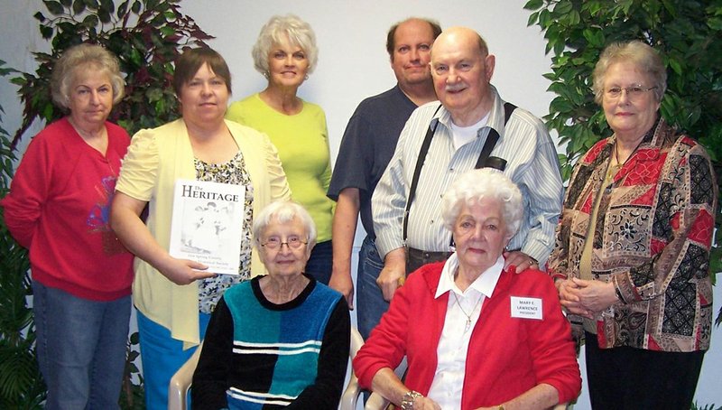 Submitted photo MUTUAL AID PROGRAMS: Hot Spring County Historical Society and The Melting Pot Genealogical Society have renewed a program where they will exchange information and items. Members in attendance at the agreement are Bennie Lambert, left standing, HSCHS recording secretary; Barbara Erdmann, MPGS librarian/registrar; Noreen Henthorne-Houpt, HSCHS; Paul Adcox, HSCHS treasurer; Homer Lawrence, HSCHS director; Loretta Walker, MPGS corresponding secretary; seated, Bonnie Stanley, HSCHS corresponding secretary; and Mary Evelyn Lawrence, HSCHS president. Not pictured is Deborah Rondeau, HSCHS editor.