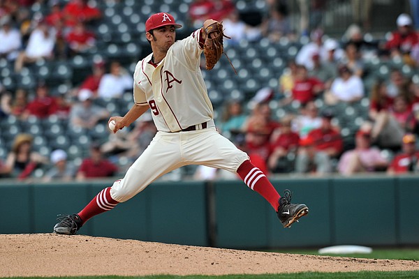 Arkansas pitcher Chris Oliver fires a pitch in the 2nd inning of the Razorbacks' game against Vanderbilt Sunday, April 20, 2014, at Baum Stadium.