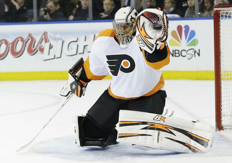 Philadelphia Flyers goalie Ray Emery stops a shot on goal during the second period against the New York Rangers in Game 1 of an NHL hockey first-round playoff series on Thursday, April 17, 2014, in New York. (AP Photo/Frank Franklin II)