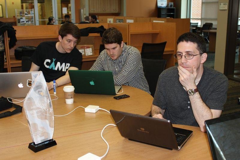 Arkansas Democrat Gazette/TINA PARKER - 04/12/2014 - Michael Lussier, left, Andy Brown, center, and Kevin Bollman, right, participate in Give Camp, an April 12 event that brought together web designers, developers and programs to create websites for non-profit organizations.
