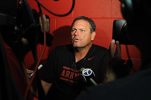 Arkansas associate head coach Sam Pittman during media day Sunday, Aug. 11, 2013 at the Fred W. Smith Football Center in Fayetteville.