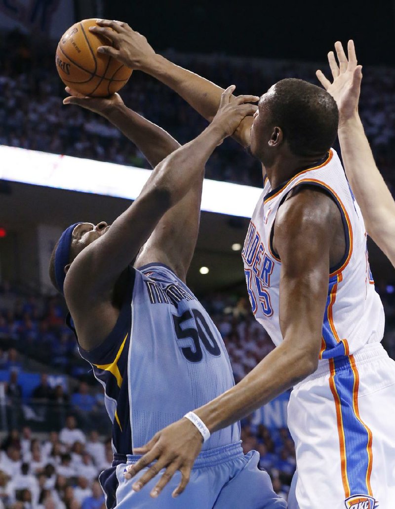 Oklahoma City Thunder forward Kevin Durant  blocks a shot by Memphis Grizzlies forward Zach Randolph (50) in the first quarter of Game 2 of an opening-round NBA basketball playoff series in Oklahoma City, Monday, April 21, 2014. (AP Photo/Sue Ogrocki)