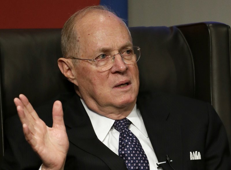 This Oct. 13, 2013, file photo shows Supreme Court Justice Anthony Kennedy speaking at the University of Pennsylvania law school in Philadelphia. The Supreme Court on Tuesday upheld Michigan's ban on using race as a factor in college admissions. 