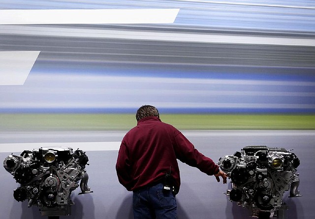 A Chevrolet Corvette Z06 engine sits on display at the New York International Auto Show, which runs through Sunday. Parent company General Motors is asking for court protection from legal claims for actions before its 2009 bankruptcy, including installing faulty ignition switches linked to 13 deaths and numerous mechanical problems. 