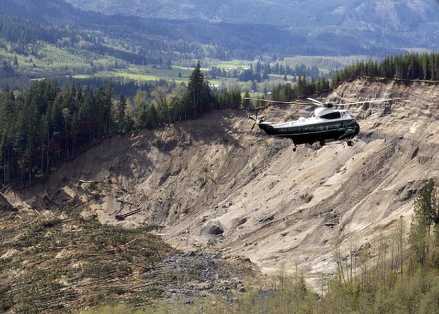 Marine One, the helicopter carrying President Barack Obama, takes an aerial tour of Oso, Wash., on Tuesday, above the site of the deadly mudslide that struck the community in March. 