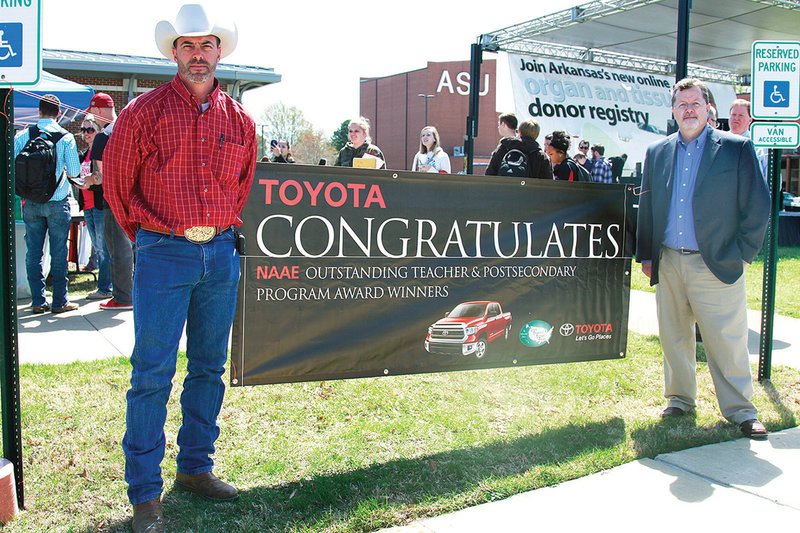 Chuck Wisdom, left, and Jerry Sites, assistant professors of agriculture at Arkansas State University-Beebe, were presented with the keys to a 2014 Toyota Tundra on April 16. ASU-Beebe received a two-year lease on the 2014 Toyota Tundra after being recognized as one of the top six Outstanding Postsecondary/Adult Agricultural Education Programs in the U.S. by the National Association of Agricultural Educators.